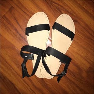 black sandals with strap on the back